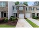 Charming townhome with brick facade, garage, well-maintained landscaping, and inviting curb appeal at 3155 Tarian Way, Decatur, GA 30034