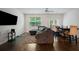 Cozy living room with comfortable seating, ceiling fan, and hardwood floors at 3155 Tarian Way, Decatur, GA 30034