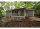 Backyard features a screened porch, trees, and tranquil outdoor space at 3521 Brookhill Cir, Marietta, GA 30062