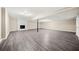 Finished basement featuring light gray floors and a charming fireplace at 3521 Brookhill Cir, Marietta, GA 30062