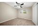 Comfortable bedroom with a ceiling fan, plush carpet, and a large window at 3521 Brookhill Cir, Marietta, GA 30062