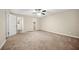 Spacious bedroom with neutral carpet, ceiling fan, and walk-in closet at 3521 Brookhill Cir, Marietta, GA 30062
