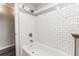 Clean bathroom features white subway tile in the shower and gray accents at 8316 Grady St, Douglasville, GA 30134