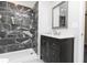 Elegant bathroom showcasing a tiled shower, modern vanity and contemporary fixtures at 8316 Grady St, Douglasville, GA 30134