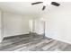 A clean and bright room features durable wood-look floors and neutral gray walls at 8316 Grady St, Douglasville, GA 30134