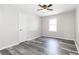 Cozy bedroom with luxury vinyl floors and neutral paint at 8316 Grady St, Douglasville, GA 30134