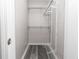 Walk-in closet featuring wood-look flooring and plenty of wire rack storage at 8316 Grady St, Douglasville, GA 30134