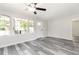 A bright living area features a large window and door overlooking a lovely porch at 8316 Grady St, Douglasville, GA 30134