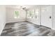 Living room with wood floors, neutral walls and large windows for natural light at 8316 Grady St, Douglasville, GA 30134