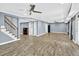 Spacious basement with wood-look flooring, recessed lighting, and modern ceiling fan at 910 Pebble Creek Trl, Suwanee, GA 30024