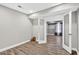 Basement featuring wood-look floors and glass French doors at 910 Pebble Creek Trl, Suwanee, GA 30024