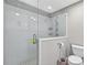 Bathroom featuring a frameless glass shower with white tile surround at 910 Pebble Creek Trl, Suwanee, GA 30024