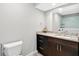 Bathroom showcasing granite countertops, sleek dark cabinetry, and modern fixtures at 910 Pebble Creek Trl, Suwanee, GA 30024