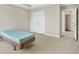Carpeted bedroom with a closet and neutral walls at 910 Pebble Creek Trl, Suwanee, GA 30024