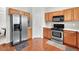 Functional kitchen featuring stainless steel appliances, and plenty of cabinet space at 910 Pebble Creek Trl, Suwanee, GA 30024