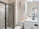 Modern bathroom with a glass-enclosed shower, white vanity, and contemporary fixtures at 2456 Hidden Creek Rd, Kennesaw, GA 30152