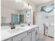 Bathroom with double sink vanity, tile floors, and glass shower at 2456 Hidden Creek Rd, Kennesaw, GA 30152
