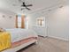 Bedroom with carpet, large mirror, white dresser, and ceiling fan at 2456 Hidden Creek Rd, Kennesaw, GA 30152