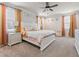 Bright bedroom featuring a ceiling fan, carpet, and curtains at 2456 Hidden Creek Rd, Kennesaw, GA 30152