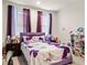 bedroom featuring bright decor, purple accents, and carpet at 2456 Hidden Creek Rd, Kennesaw, GA 30152