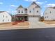 Charming two-story home boasts a well-manicured lawn and an attached two-car garage at 2456 Hidden Creek Rd, Kennesaw, GA 30152