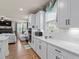 Stylish kitchen features white cabinetry, quartz countertops, and stainless appliances at 2456 Hidden Creek Rd, Kennesaw, GA 30152