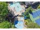 Birds-eye view of the community pool, baby pool, tennis court and gazebo surrounded by mature trees at 3028 Towneside Ln, Woodstock, GA 30189