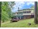 Spacious backyard featuring an expansive deck and a covered screened porch for outdoor enjoyment at 3028 Towneside Ln, Woodstock, GA 30189
