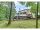 Expansive backyard with a spacious deck and screened-in porch, perfect for outdoor entertaining at 3028 Towneside Ln, Woodstock, GA 30189