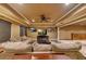 Finished basement living room area with neutral decor, ceiling fan, recessed lighting, and luxury vinyl flooring at 3028 Towneside Ln, Woodstock, GA 30189