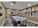 Finished basement featuring luxury vinyl plank flooring, game area and sports team decor at 3028 Towneside Ln, Woodstock, GA 30189