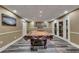 Finished basement featuring game area with pool table, luxury vinyl plank flooring, and recessed lighting at 3028 Towneside Ln, Woodstock, GA 30189