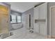 Bright bathroom featuring a soaking tub, walk-in shower, and custom white cabinetry at 3028 Towneside Ln, Woodstock, GA 30189