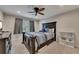 Cozy bedroom featuring a ceiling fan, a queen-sized bed, and a side table at 3028 Towneside Ln, Woodstock, GA 30189
