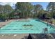 Relaxing community pool offers clear water, marked lanes, and plenty of seating to enjoy a hot summer's day at 3028 Towneside Ln, Woodstock, GA 30189