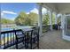 Outdoor deck features seating area overlooking the tennis courts at 3028 Towneside Ln, Woodstock, GA 30189
