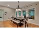 Cozy dining room featuring a modern chandelier, natural light, and an inviting atmosphere at 3028 Towneside Ln, Woodstock, GA 30189