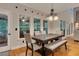 Well-lit dining room with an elegant chandelier and views of the outdoors at 3028 Towneside Ln, Woodstock, GA 30189