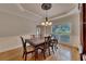 Charming dining room featuring hardwood floors, classic decor, and a window with a view at 3028 Towneside Ln, Woodstock, GA 30189