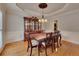 Elegant dining room with traditional furniture, hardwood floors, and classic chandelier at 3028 Towneside Ln, Woodstock, GA 30189