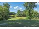 Lush golf course with manicured greens, sand traps, and mature trees at 3028 Towneside Ln, Woodstock, GA 30189