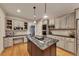 Updated kitchen with a center island, stainless appliances, and plenty of counter space at 3028 Towneside Ln, Woodstock, GA 30189