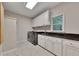 Well-equipped laundry room with side by side washer and dryer, storage, and granite countertops at 3028 Towneside Ln, Woodstock, GA 30189