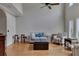 Open living room with hardwood floors, high ceilings, and comfortable seating arrangement at 3028 Towneside Ln, Woodstock, GA 30189