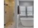 Spa-like main bathroom showcases a standalone tub, walk-in shower, and elegant finishes, perfect for relaxation at 3028 Towneside Ln, Woodstock, GA 30189