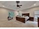 Spacious main bedroom with a tray ceiling, plush carpet, and large windows offering ample natural light at 3028 Towneside Ln, Woodstock, GA 30189