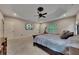 A large main bedroom features a tray ceiling and a TV for entertainment. An exercise machine is also visible at 3028 Towneside Ln, Woodstock, GA 30189
