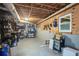 Unfinished basement offers storage, shelving, a workbench, and a window at 4409 Woodward Mill Rd, Sugar Hill, GA 30518