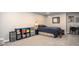 Finished basement bedroom, including a bed, desk, and storage at 4409 Woodward Mill Rd, Sugar Hill, GA 30518