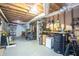 Unfinished basement with exposed ceiling, utility components, and storage area at 4409 Woodward Mill Rd, Sugar Hill, GA 30518